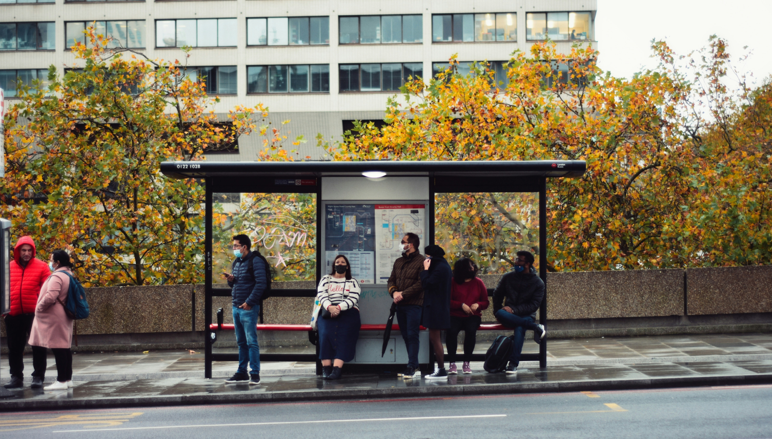 People waiting at a bus stop